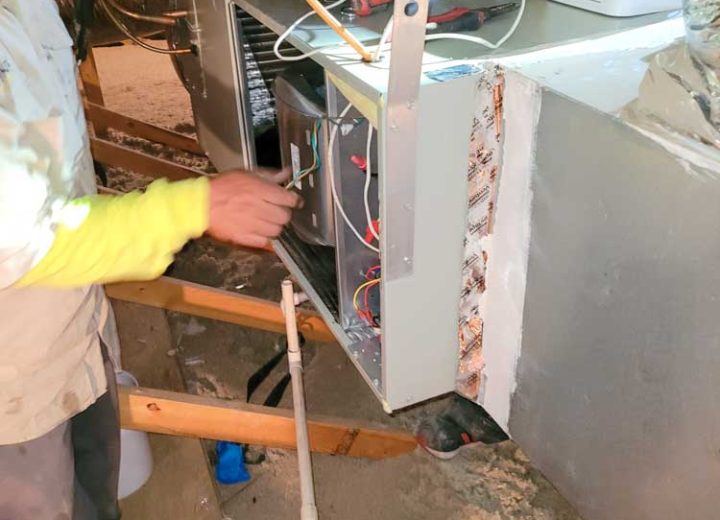 A skilled HVAC technician doing AC Repair and Maintenance