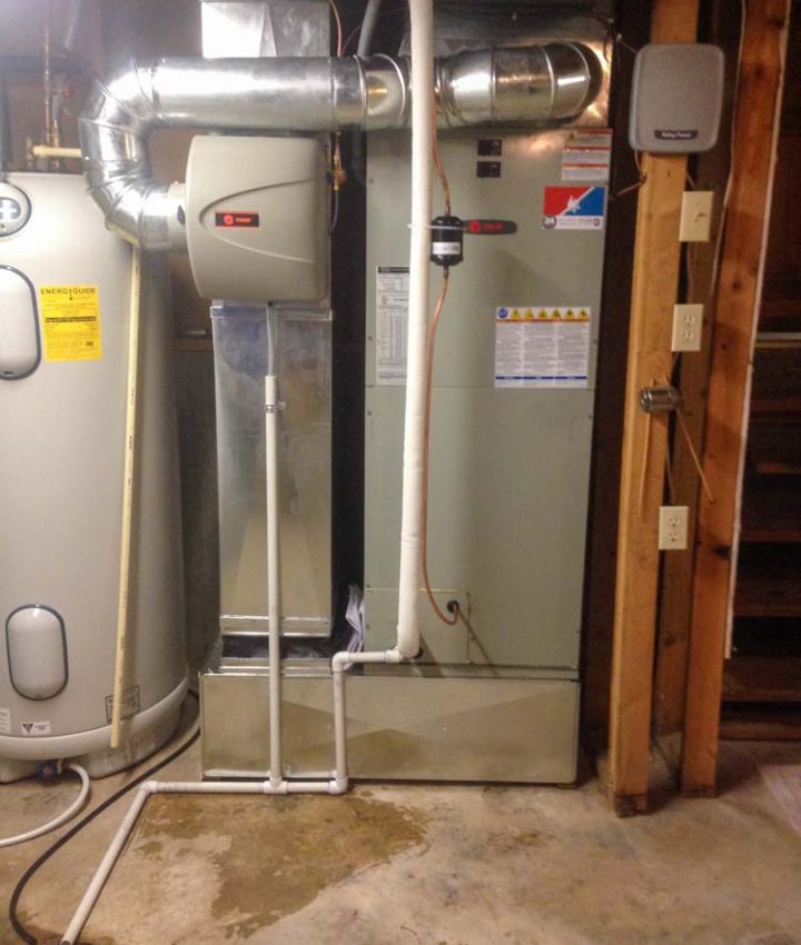 HVAC system neatly installed in a residential basement, featuring sleek ductwork